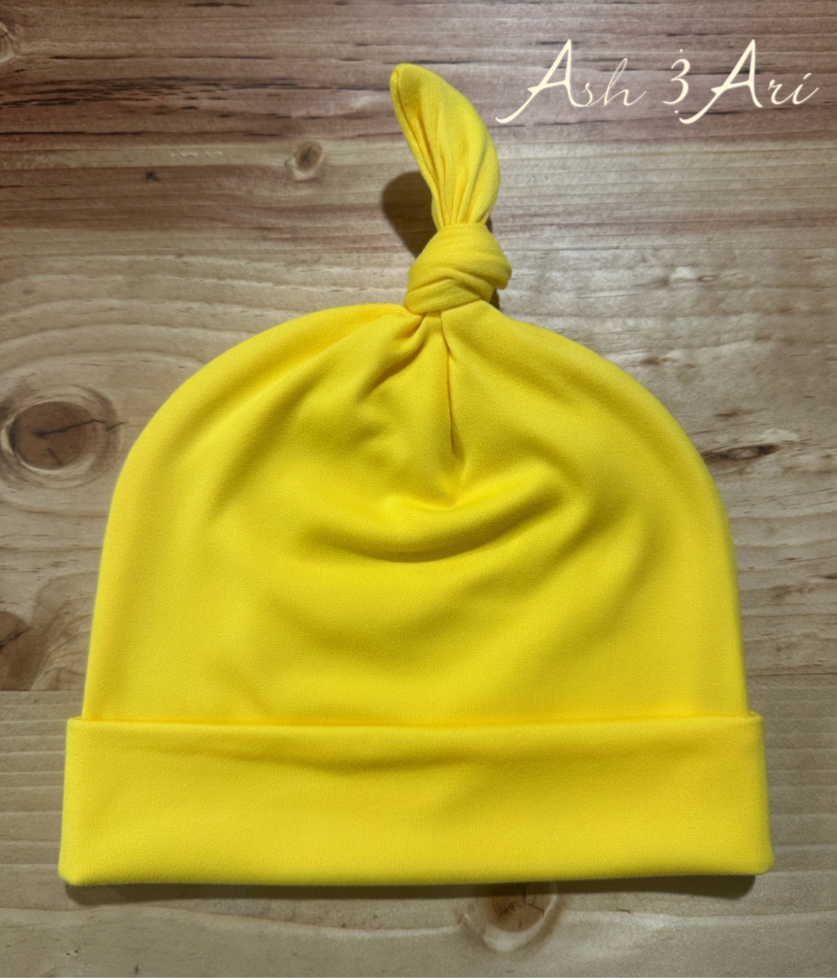 Top knotted beanie